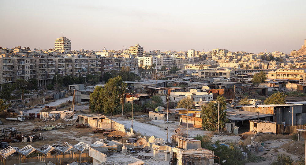 A picture taken on July 29, 2016 shows a general view of Karaj al-Hajz corridor (C) in the rebel-held part of Aleppo, leading towards the government controlled area of the Masharqa neighbourhood (background)